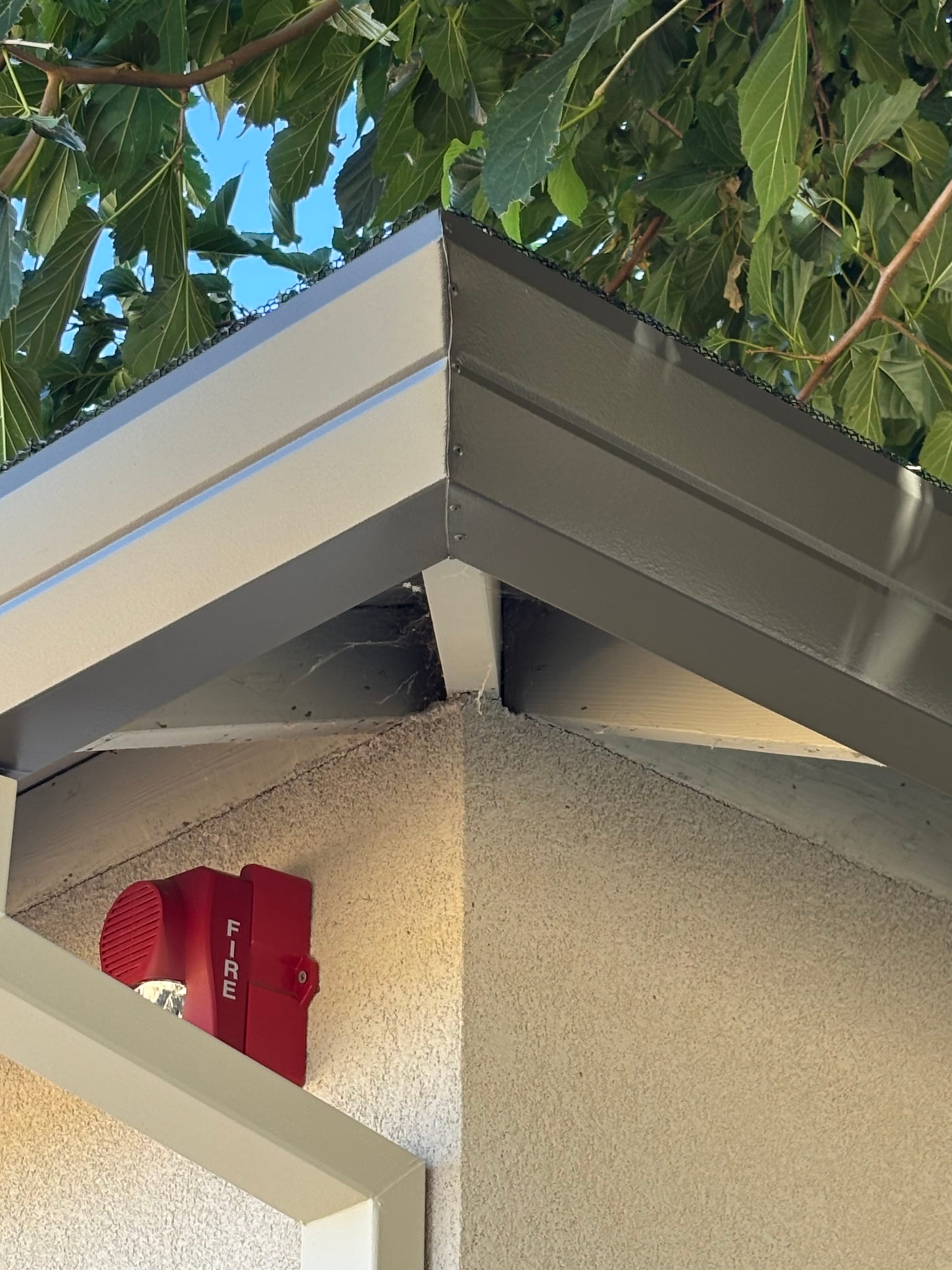 Close-up detail of a fascia-style gutter corner seam