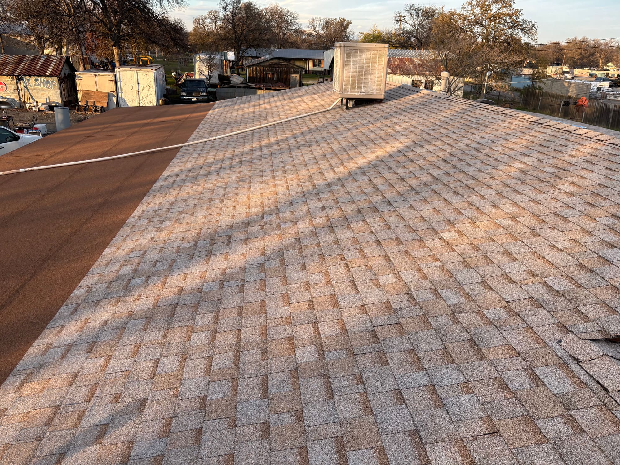Low-slope roofing membrane on a commercial-style building roof
