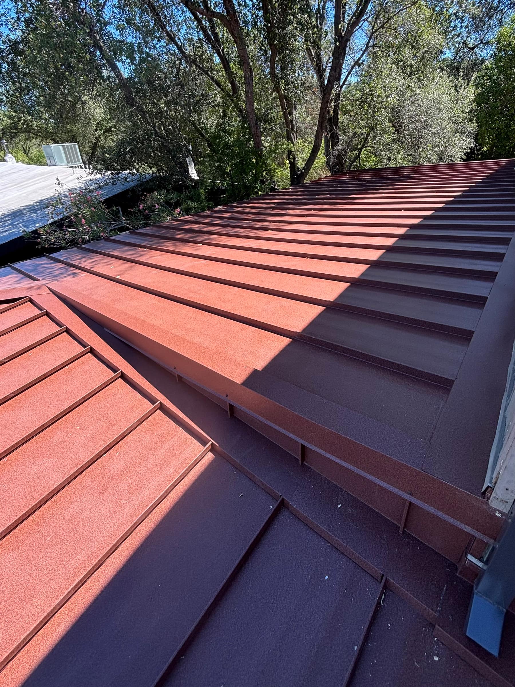 Close-up of standing-seam metal roofing panel seams